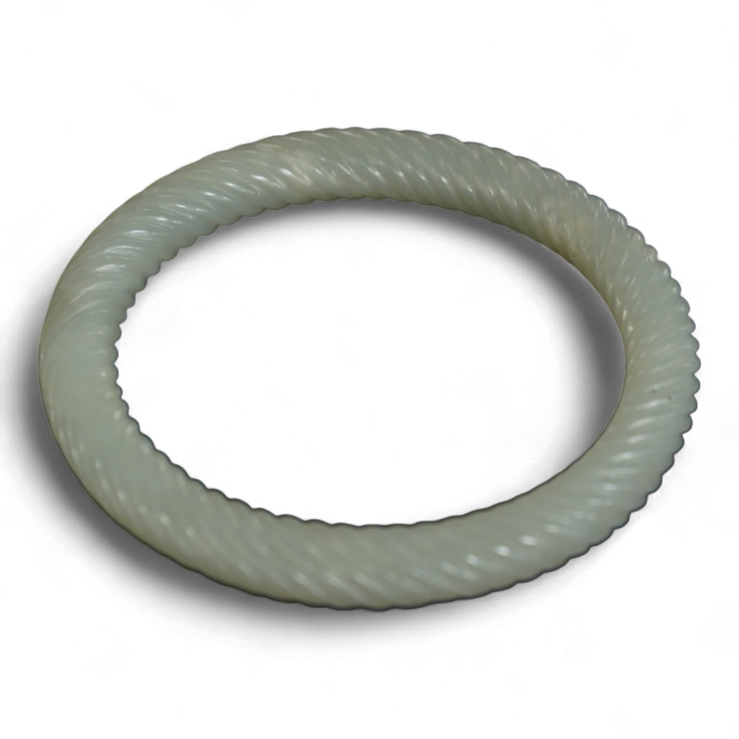 A Chinese pale celadon jade rope twist carved bangle, 8cm diameter